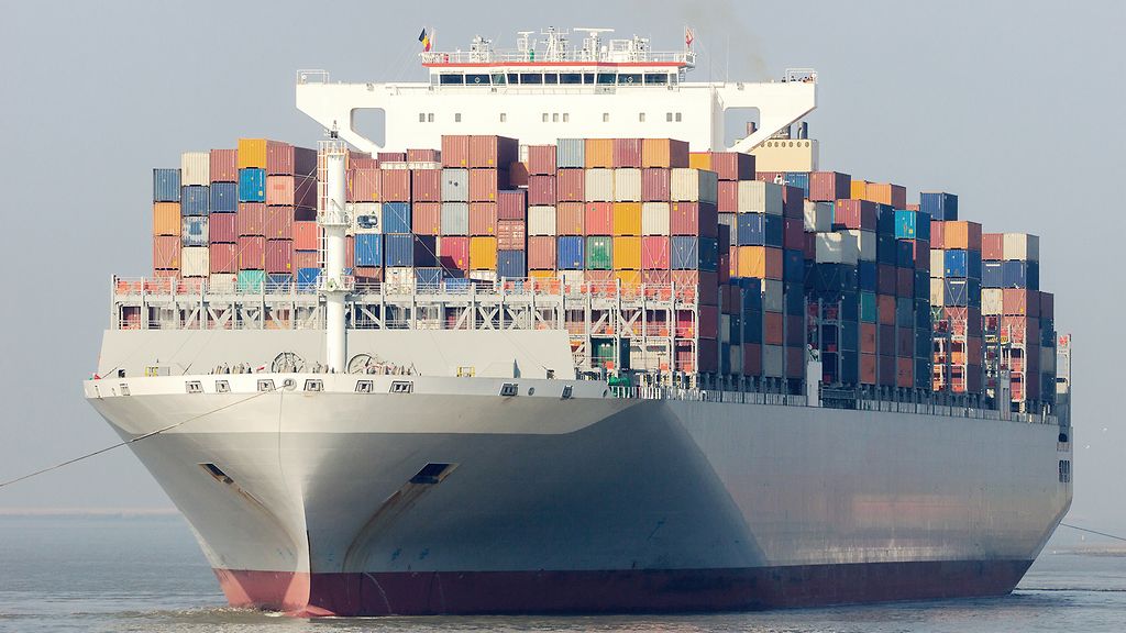 ANTWERP, BELGIUM - MAR 12, 2016: Container ship OOCL Singapore leaving a container terminal in the Port of Antwerp.