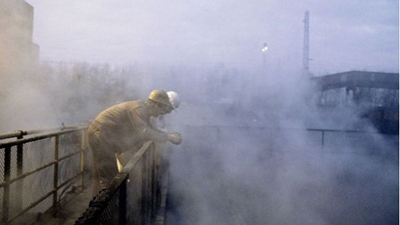 Clouds of steam billow up from the giant fire-quenching water tanks at a coking plant at Zollverein