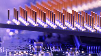 Electronic components held in hand in laboratory, close up