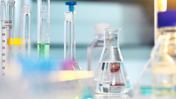 Scientific apparatus and glassware on laboratory bench awaiting Experiment