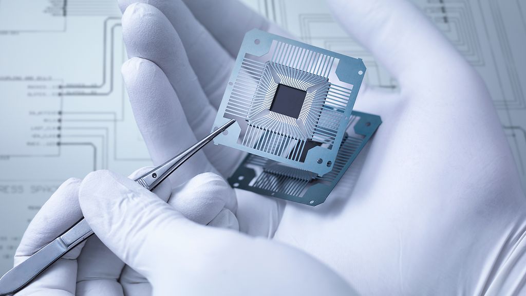 Electronic components held in hand in laboratory, close up| ©Monty Rakusen/Getty Images