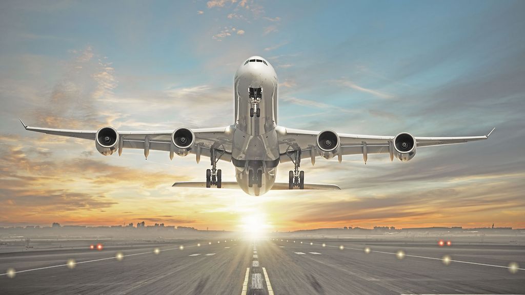 Huge two storeys commercial jetliner taking of runway. Modern and fastest mode of transportation. Dramatic sunset sky on background