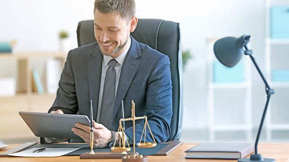 Young male notary working in office